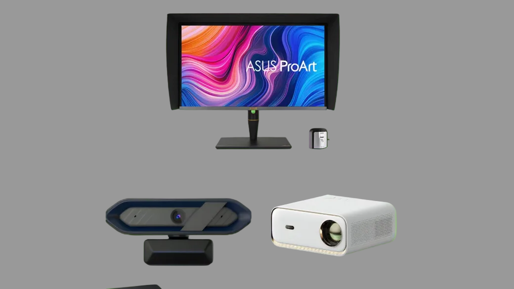 Asus ProArt monitor, webcam, and projector on a green background